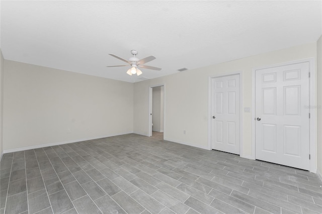 interior space featuring ceiling fan