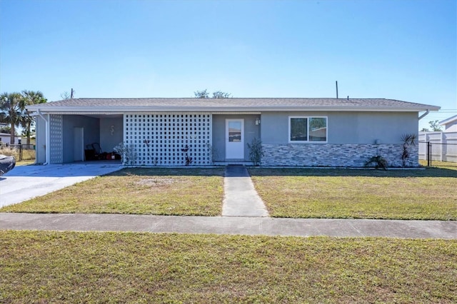 single story home featuring a front yard and a carport