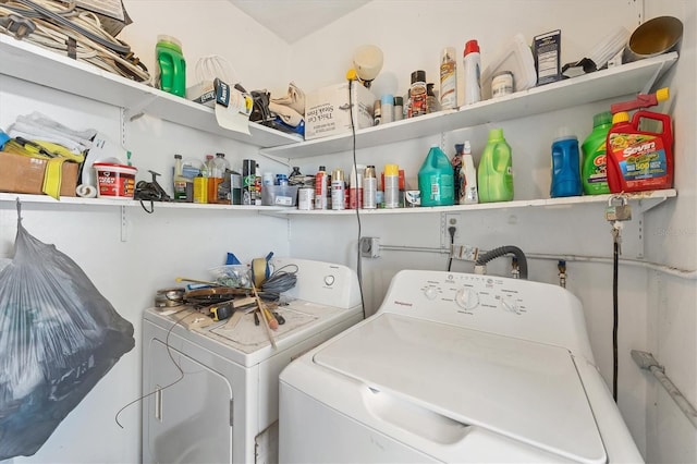 clothes washing area featuring separate washer and dryer