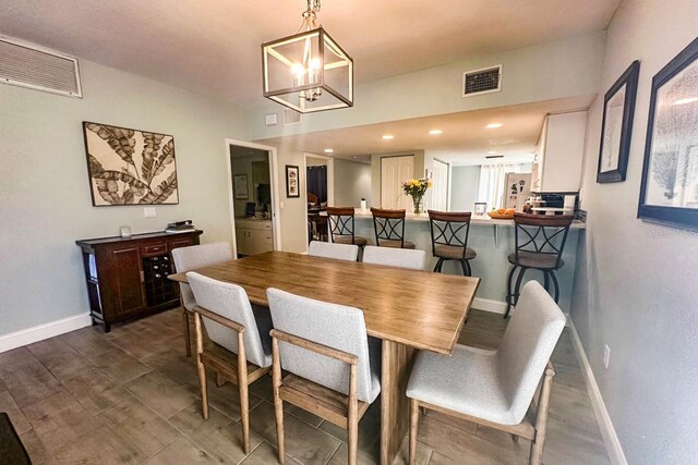 dining space featuring a chandelier