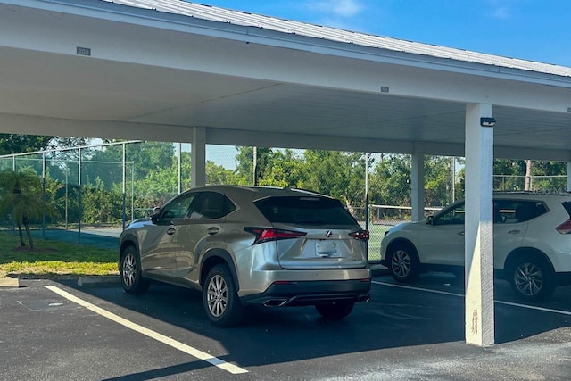 view of parking / parking lot featuring a carport