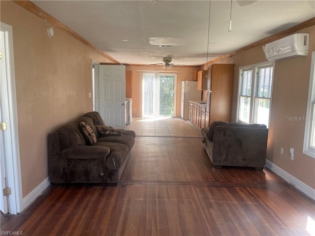 living room with crown molding, a healthy amount of sunlight, and a wall mounted air conditioner