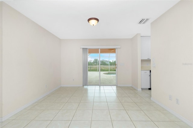 empty room with light tile patterned flooring