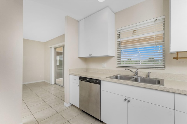 kitchen featuring dishwasher, light tile patterned flooring, white cabinetry, and sink