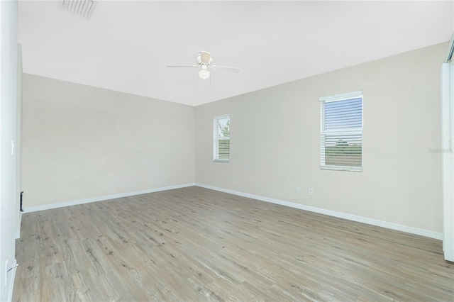 unfurnished room with ceiling fan and light hardwood / wood-style flooring