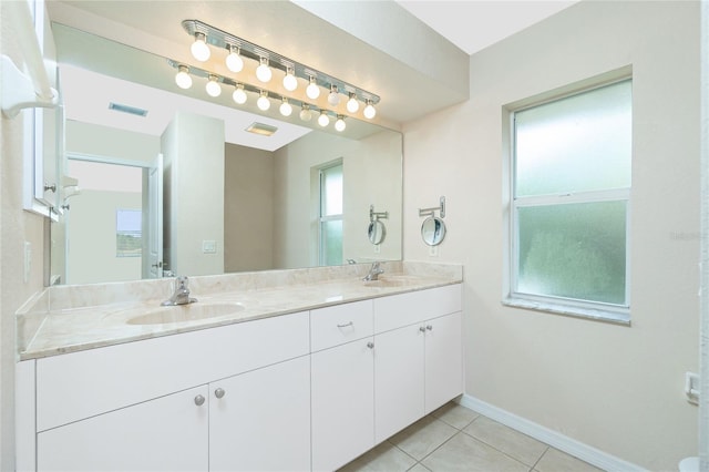 bathroom featuring tile patterned flooring and vanity