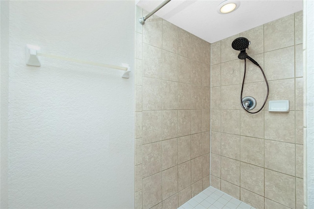 bathroom with tiled shower