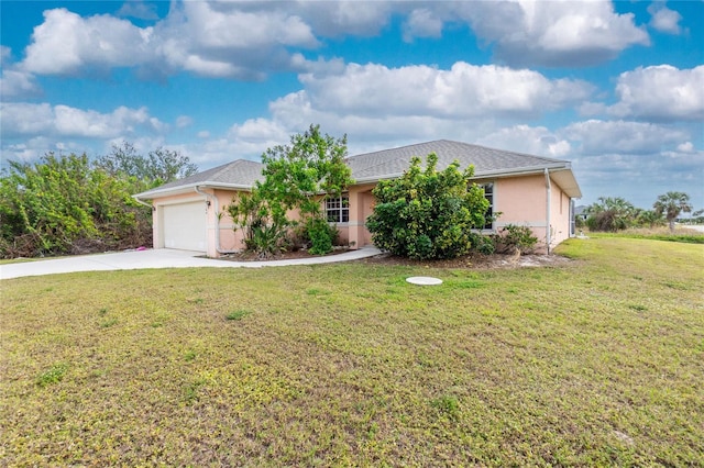 single story home with a front yard and a garage