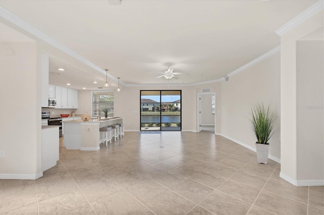 living room featuring ceiling fan, sink, light tile patterned floors, and ornamental molding