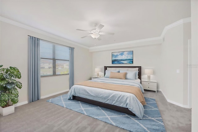 carpeted bedroom with ceiling fan and ornamental molding