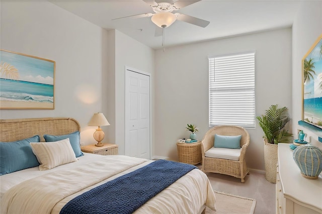 bedroom with ceiling fan, a closet, and carpet floors