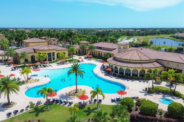 view of swimming pool featuring a water view