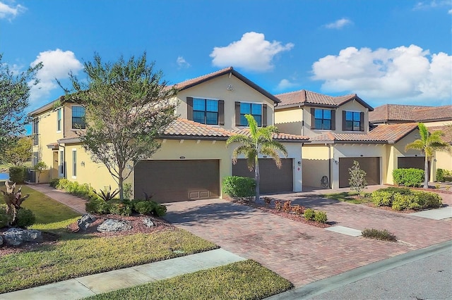 mediterranean / spanish-style home with a garage