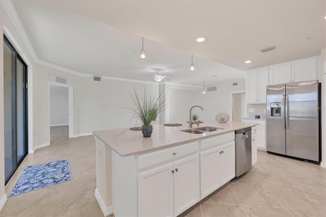 kitchen featuring a kitchen island with sink, sink, white cabinets, and appliances with stainless steel finishes