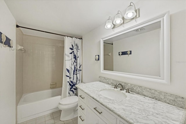 full bathroom featuring tile patterned floors, shower / bath combo, toilet, and vanity