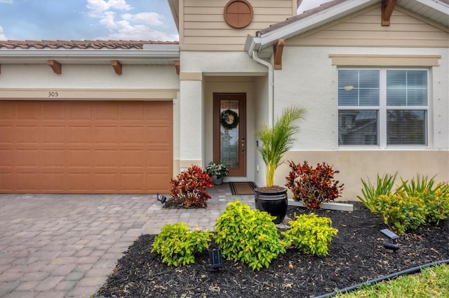 entrance to property featuring a garage