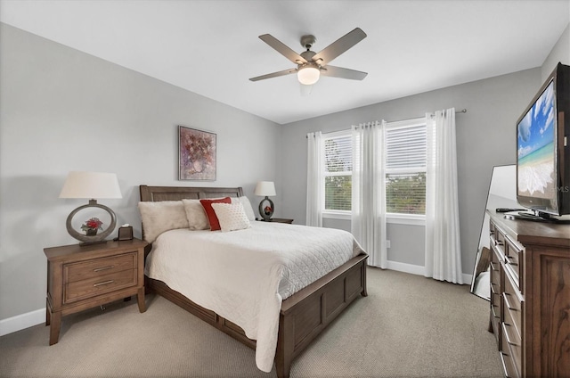 bedroom featuring ceiling fan and light carpet