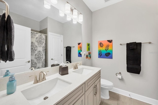 bathroom with toilet, vanity, and curtained shower