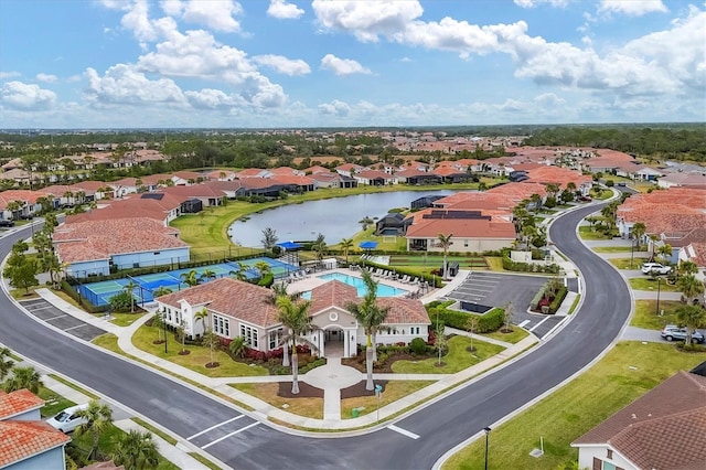 birds eye view of property with a water view