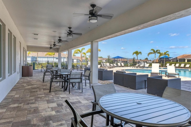 view of patio / terrace featuring an outdoor hangout area, ceiling fan, and a community pool