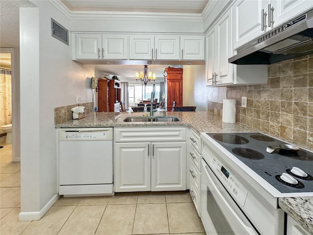 kitchen featuring sink, dishwasher, range, white cabinetry, and light tile patterned flooring