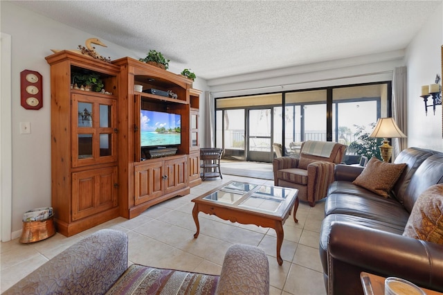 living room with light tile patterned floors and a textured ceiling