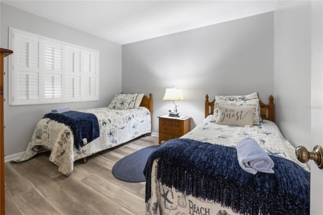 bedroom with wood-type flooring