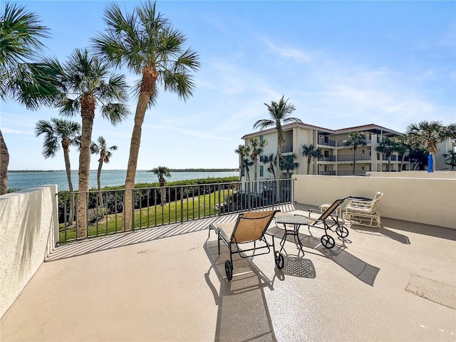 view of patio featuring a water view