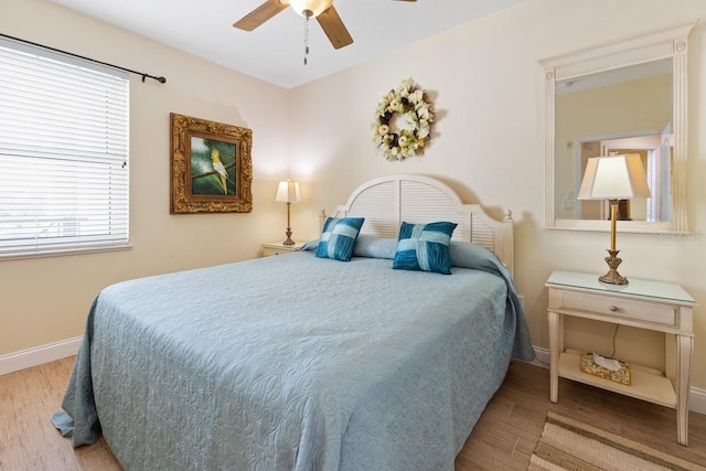 bedroom featuring ceiling fan and hardwood / wood-style flooring