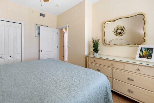 bedroom featuring ceiling fan and a closet