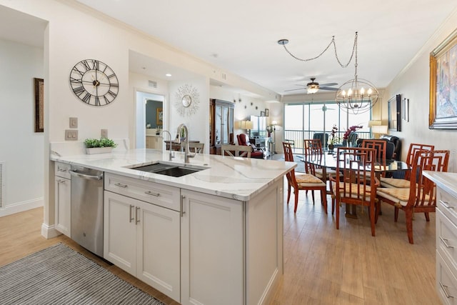 kitchen featuring ceiling fan, sink, stainless steel dishwasher, white cabinets, and light wood-type flooring