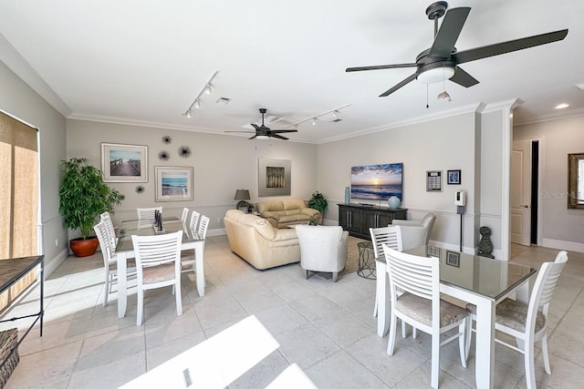 dining area featuring crown molding, ceiling fan, and track lighting