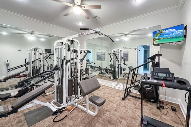 workout area featuring ceiling fan and ornamental molding