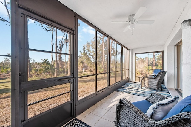 sunroom / solarium featuring ceiling fan