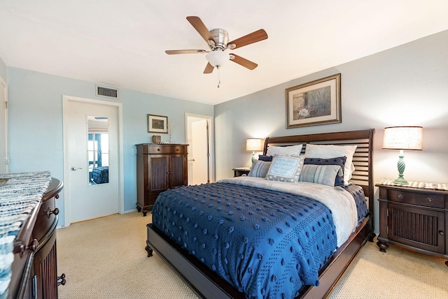 bedroom featuring light carpet and ceiling fan