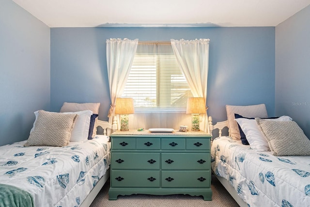 bedroom featuring light carpet