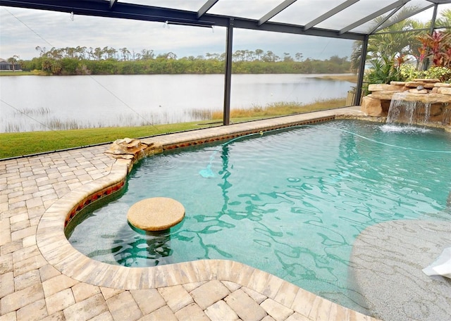 view of pool featuring a lanai, a patio area, pool water feature, and a water view