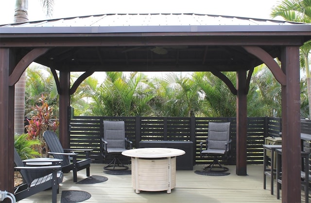 wooden terrace featuring a gazebo