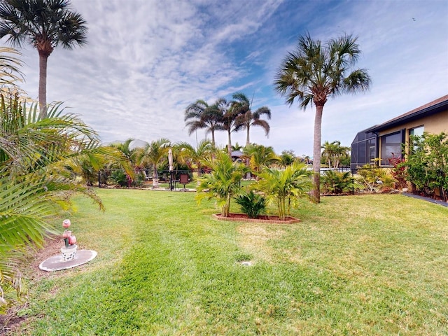 view of yard featuring a lanai