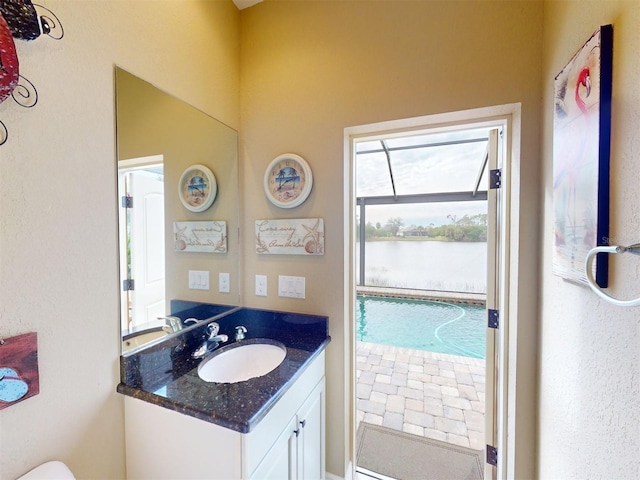 bathroom with vanity and a water view