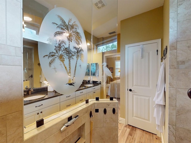 bathroom with vanity and hardwood / wood-style flooring