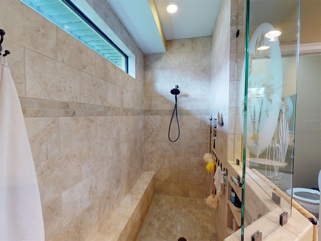 bathroom featuring a tile shower