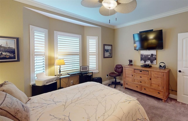 carpeted bedroom featuring ornamental molding and ceiling fan