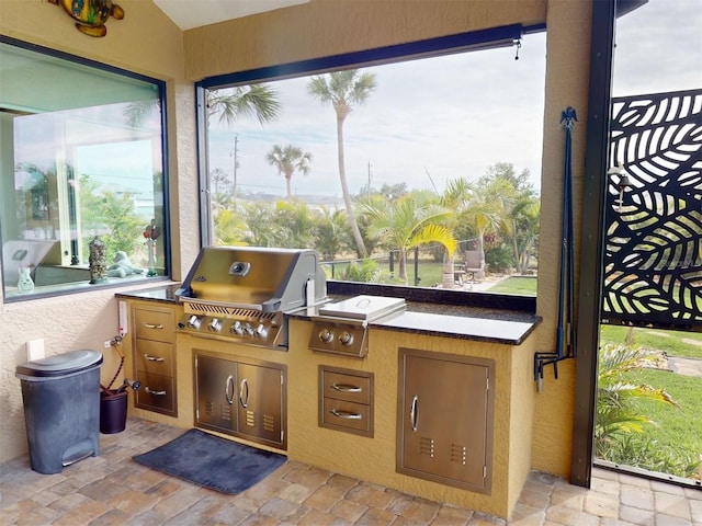 view of patio / terrace with an outdoor kitchen and grilling area