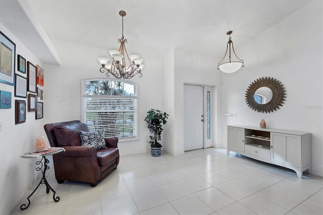 sitting room featuring light tile patterned floors and an inviting chandelier