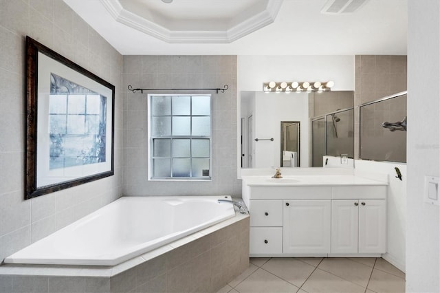 bathroom with vanity, plus walk in shower, tile patterned floors, a raised ceiling, and ornamental molding