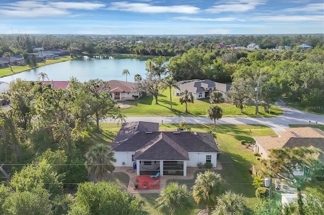 birds eye view of property with a water view