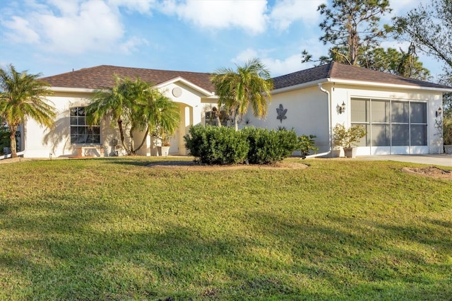 ranch-style house featuring a front lawn