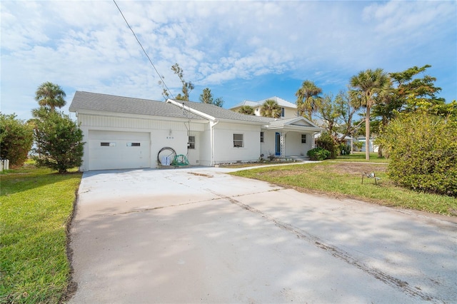 single story home with a garage and a front yard