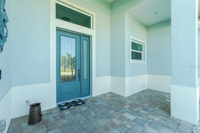 doorway to property featuring covered porch